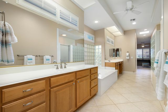 a large kitchen with a lot of counter space and a sink