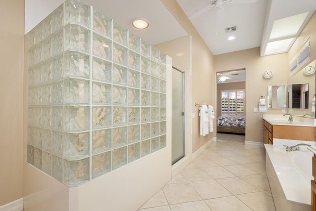 a bathroom with a double vanity sink and mirror