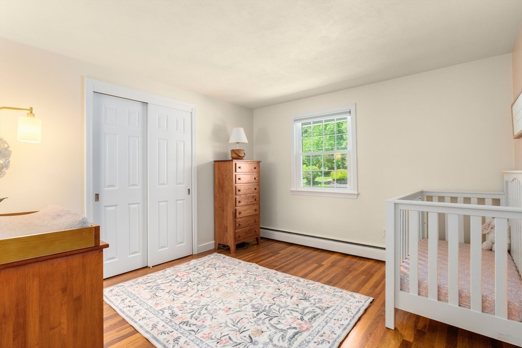 11 Longmeadow Road Medfield, MA 02052 - Photo 17 of 39 a view of an empty room with wooden floor and window