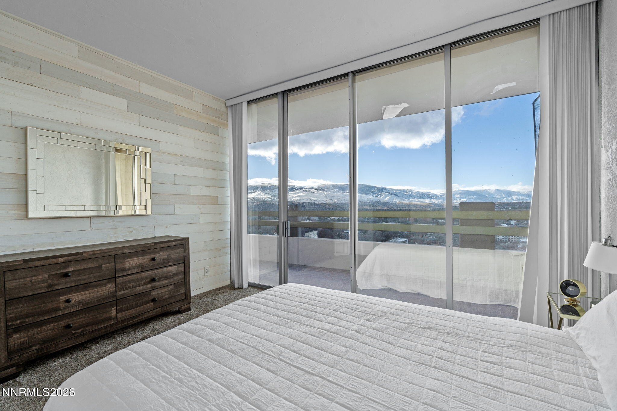 100 North Arlington Avenue, Unit 22G Reno, NV 89501 - Photo 11 of 37 a bedroom with a bed and a large window