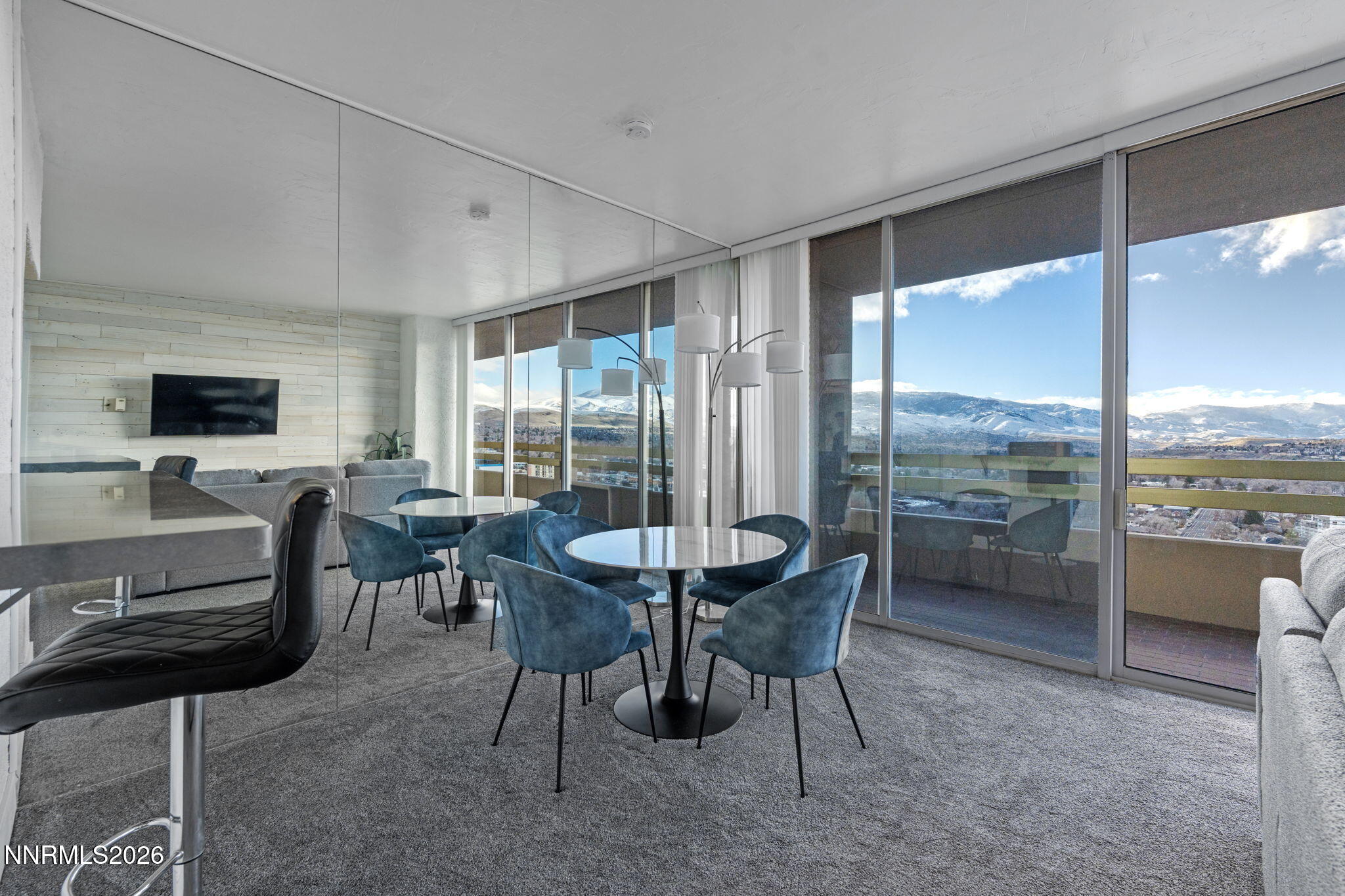 100 North Arlington Avenue, Unit 22G Reno, NV 89501 - Photo 15 of 37 a dining room with furniture and a floor to ceiling window