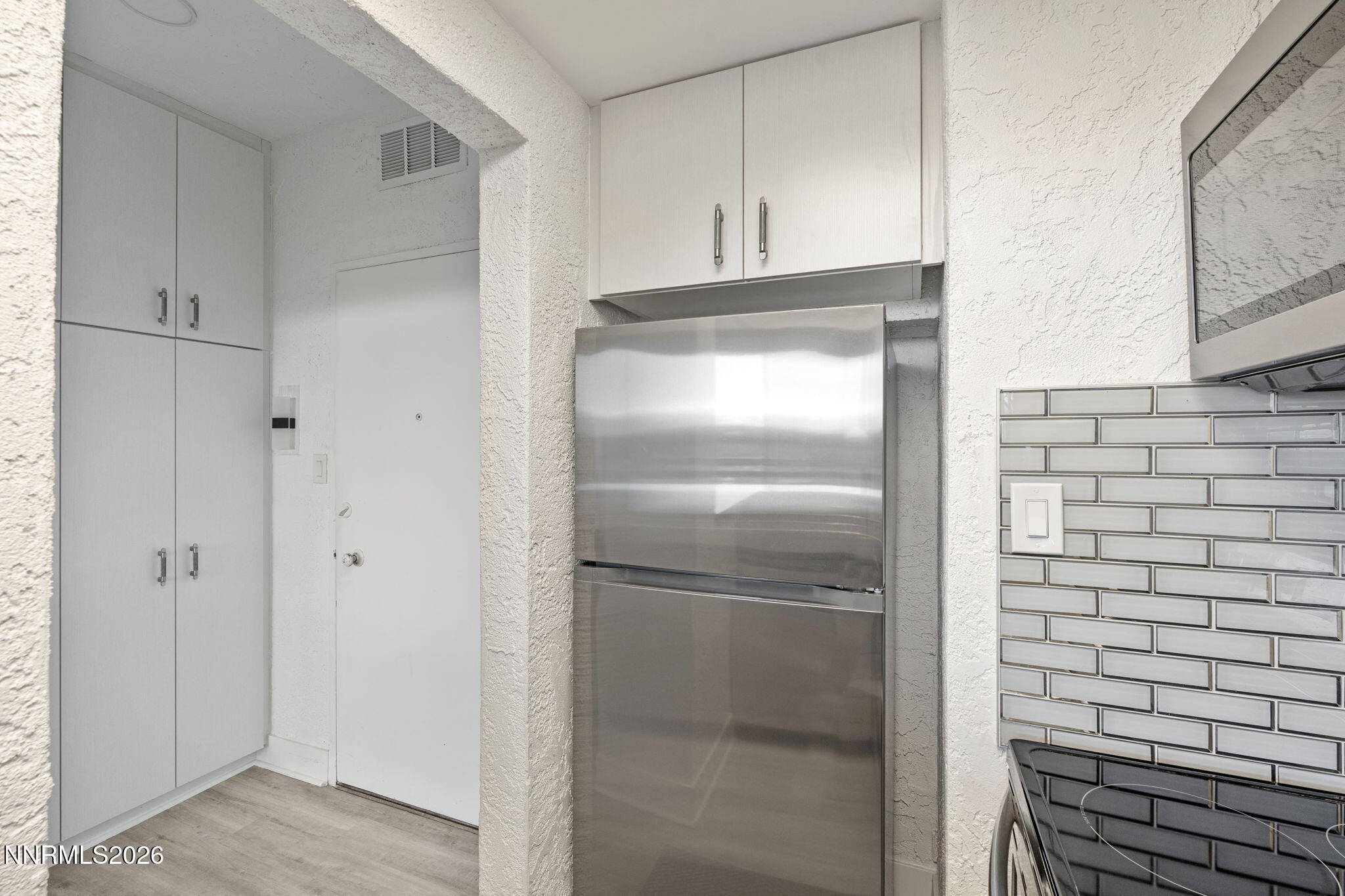 100 North Arlington Avenue, Unit 22G Reno, NV 89501 - Photo 20 of 37 a kitchen with a refrigerator