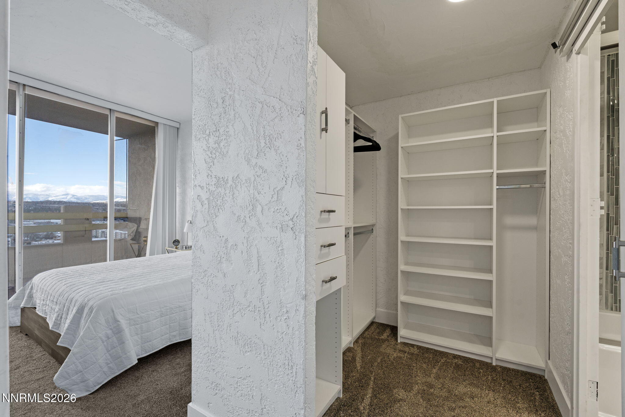 100 North Arlington Avenue, Unit 22G Reno, NV 89501 - Photo 30 of 37 a bedroom with a bed and a window