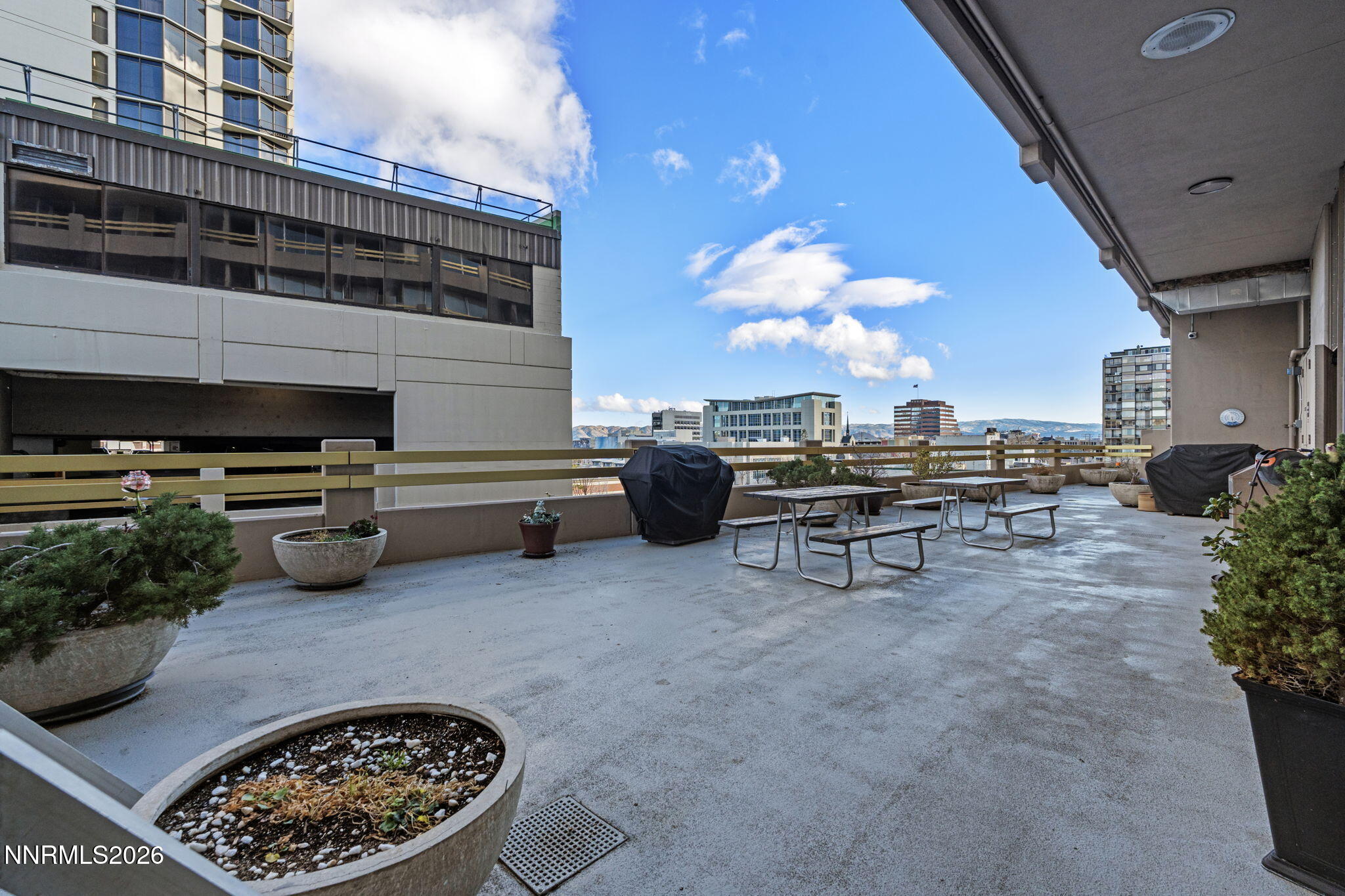 100 North Arlington Avenue, Unit 22G Reno, NV 89501 - Photo 32 of 37 a view of a chairs and fire pit in the patio