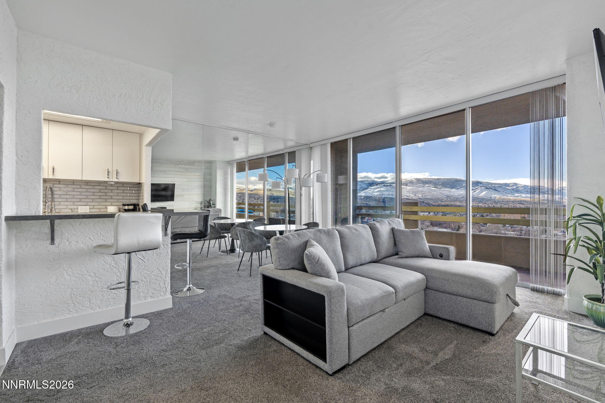 100 North Arlington Avenue, Unit 22G Reno, NV 89501 - Photo 6 of 37 a living room with furniture and a large window