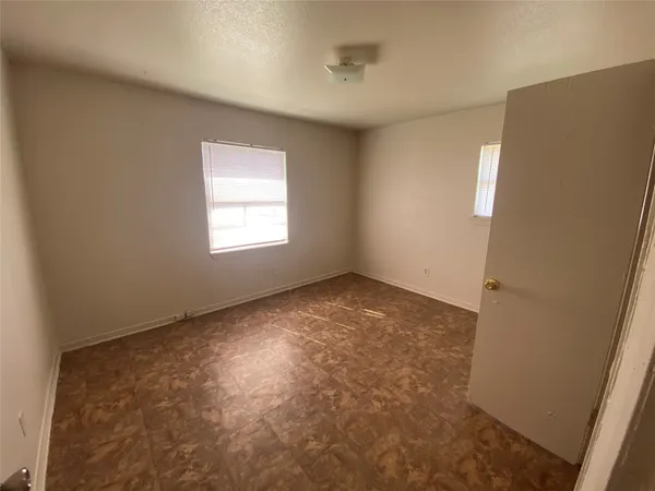 a view of empty room with windows