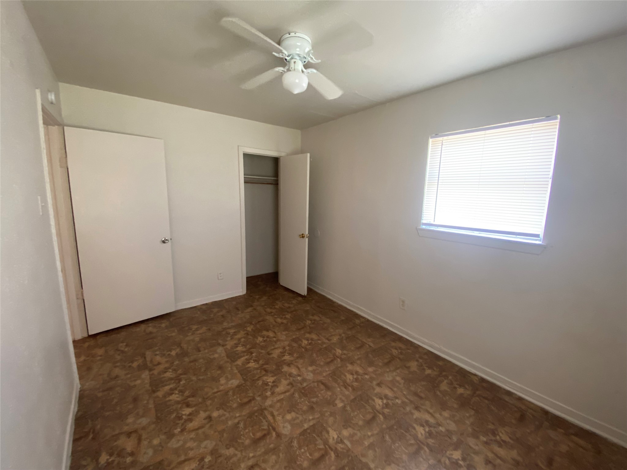 4223 Rockingham Street Houston, TX 77051 - Photo 7 of 13 an empty room with windows and fan