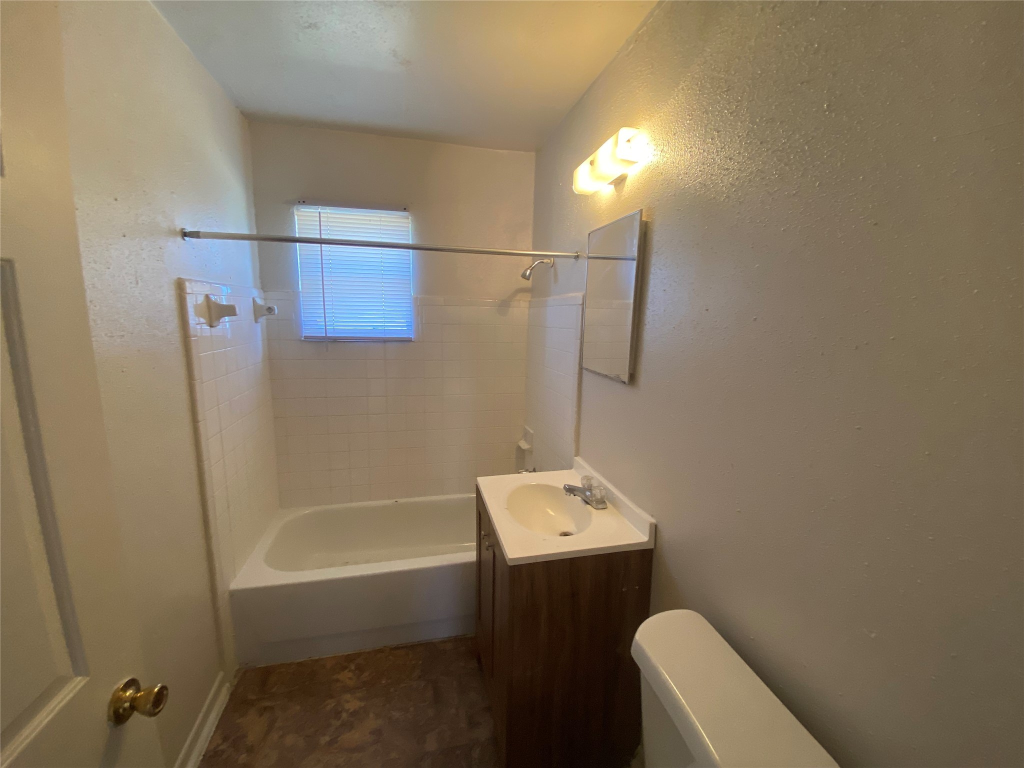 4223 Rockingham Street Houston, TX 77051 - Photo 8 of 13 a bathroom with a bathtub toilet and sink