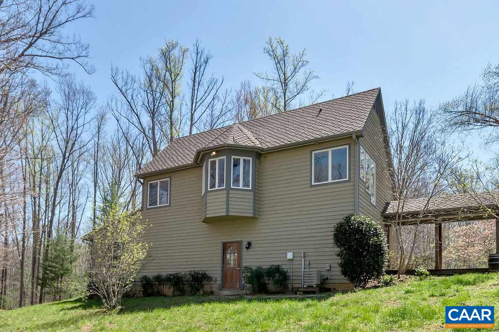 3700 Millington Road Free Union, VA 22940 - Photo 41 of 41 a front view of a house with a garden and plants