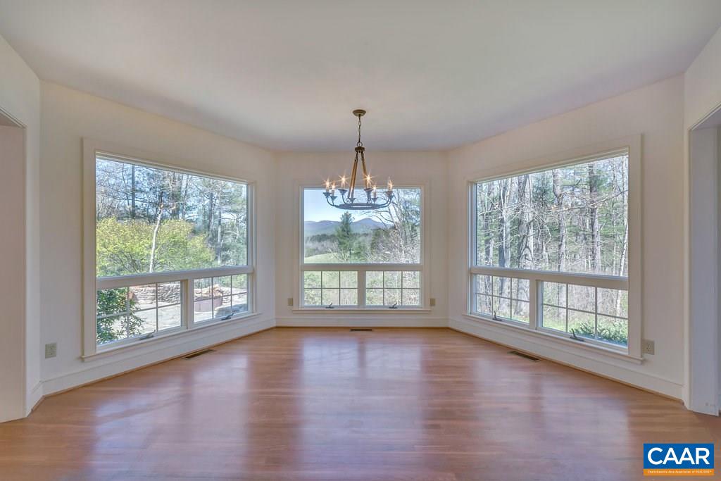 3700 Millington Road Free Union, VA 22940 - Photo 6 of 41 a view of an empty room with wooden floor and a window