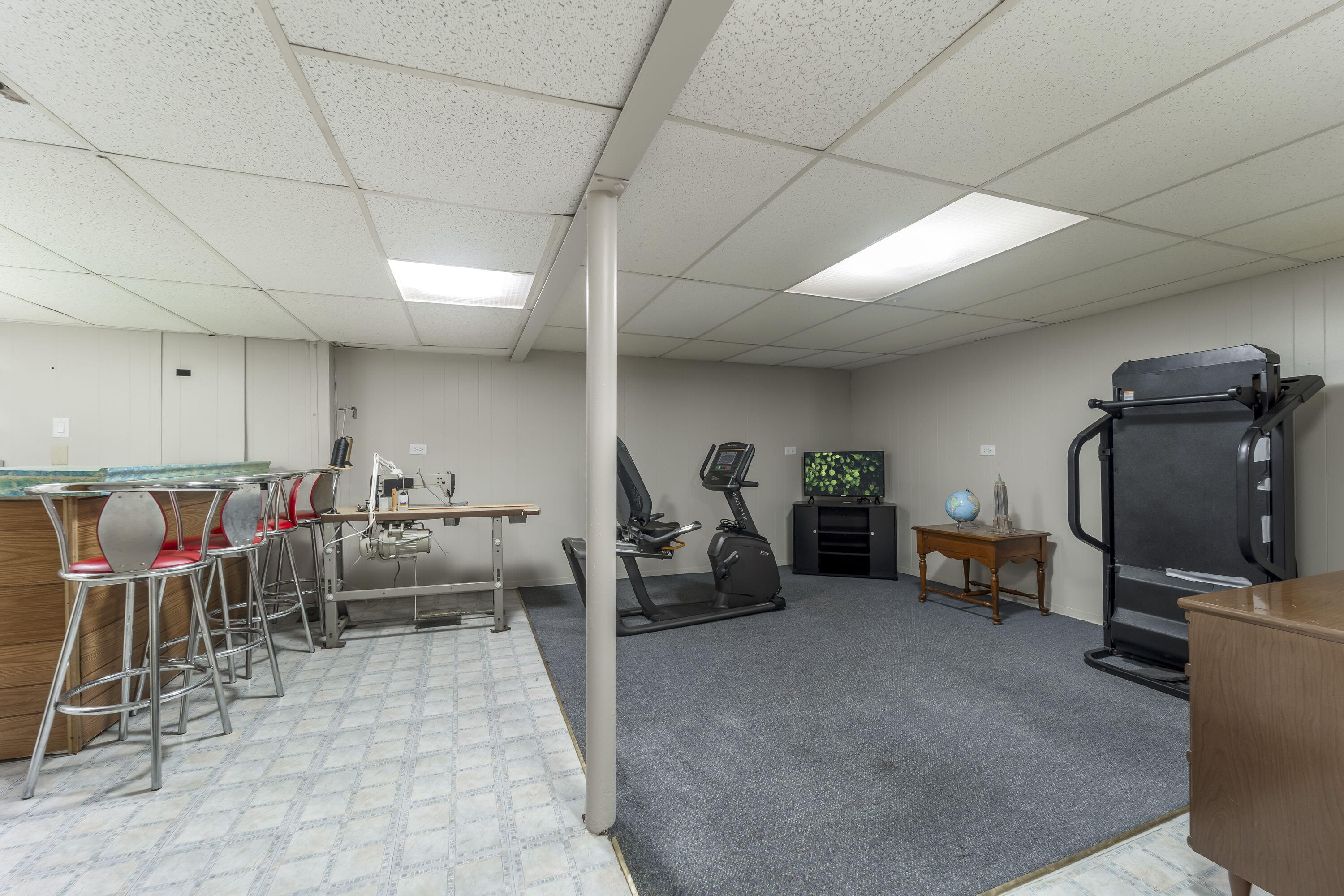 3603 South 23rd Street Milwaukee, WI 53221 - Photo 14 of 23 The spacious lower-level rec room/family room provides flexible living space. Ideal for entertaining, a home office, fitness area, or hobby room.
