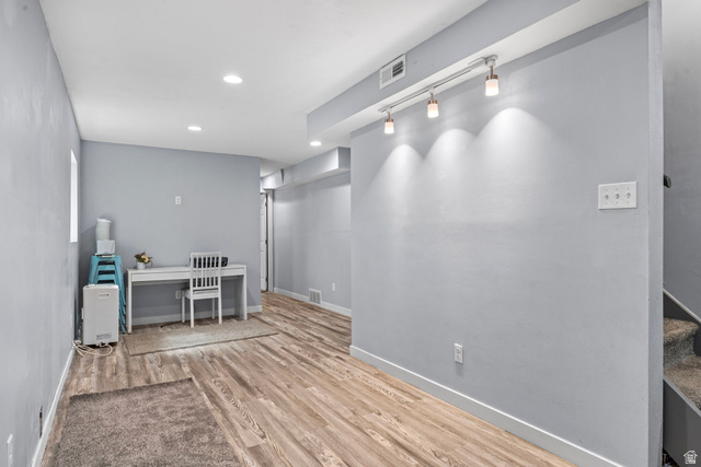 564 Swenson Avenue Springville, UT 84663 - Photo 19 of 26 Recessed ceiling lighting, wood-finish flooring, painted walls, track lighting with three fixtures, and a window