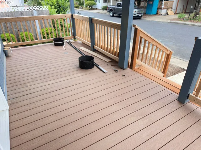 a view of deck with wooden floor and fence