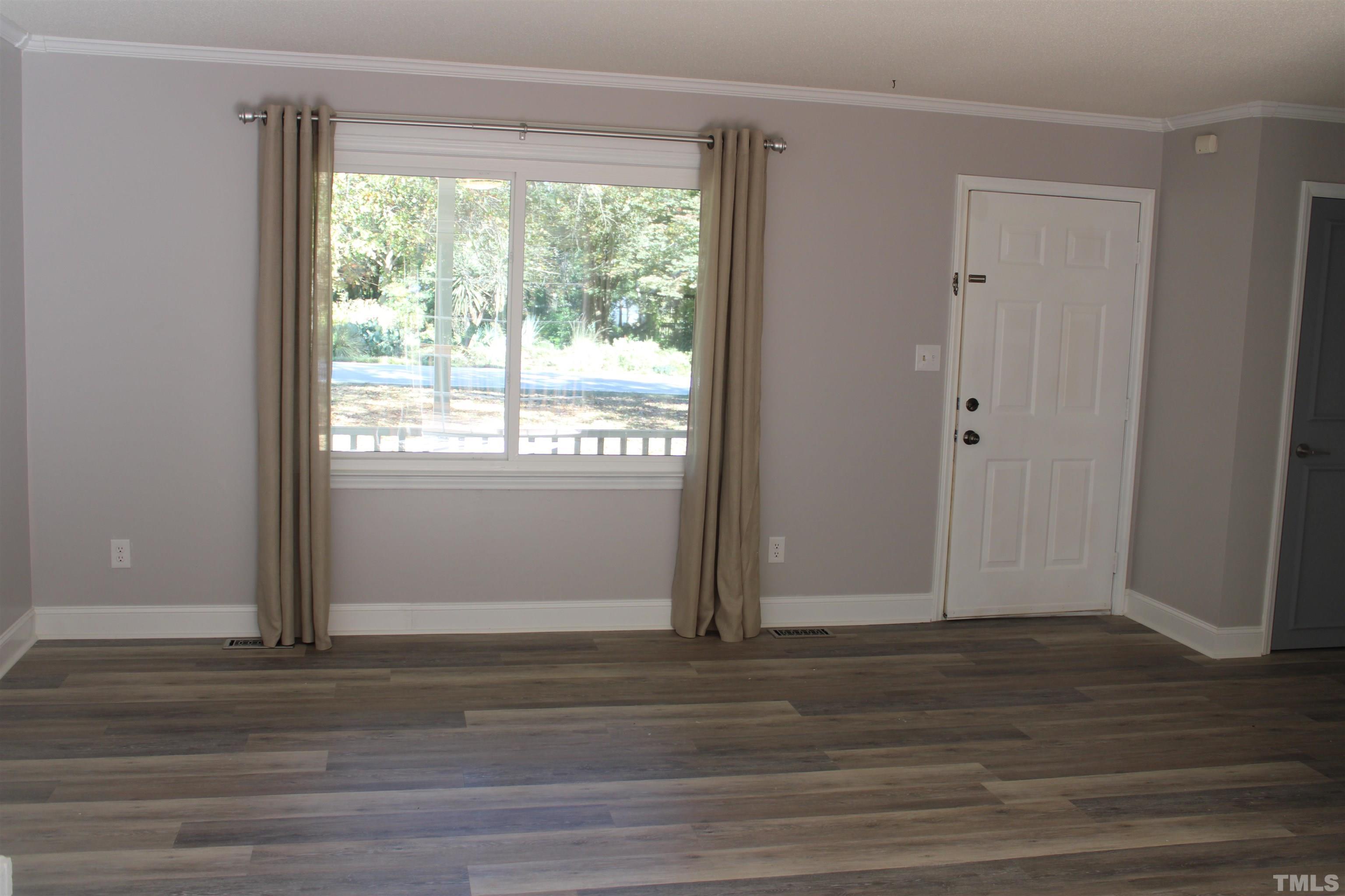 9300 Sauls Road Raleigh, NC 27603 - Photo 7 of 17 a view of wooden floor and cabinet