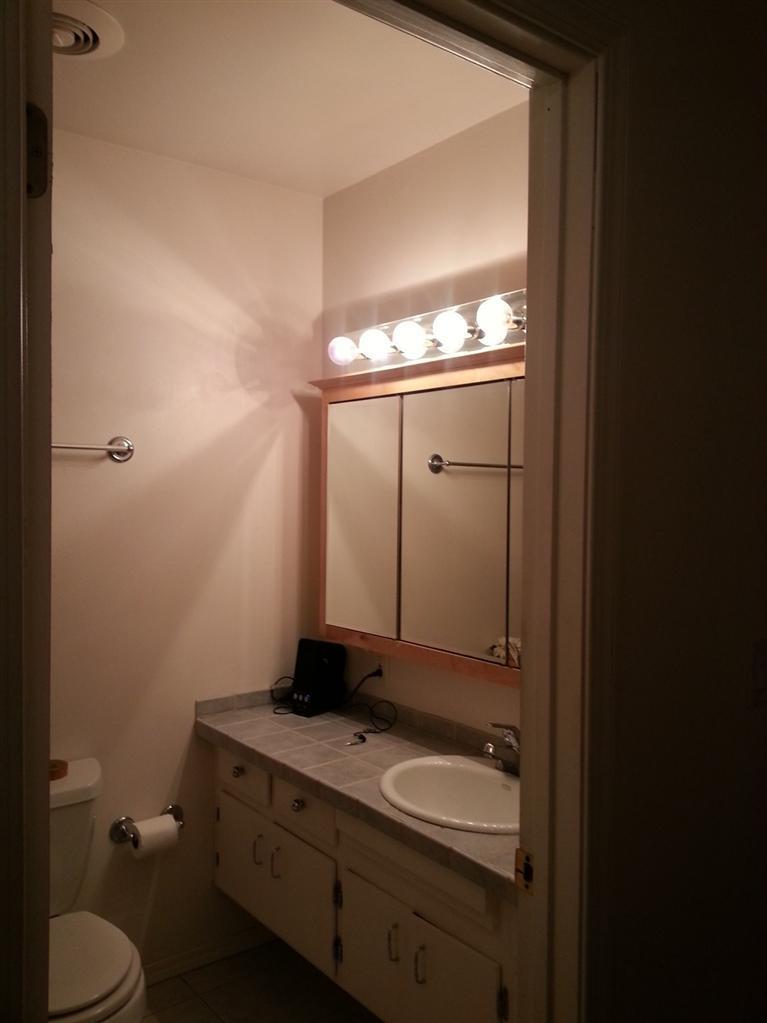 786 Appleton Road Simi Valley, CA 93065 - Photo 5 of 8 a bathroom with a toilet sink and mirror