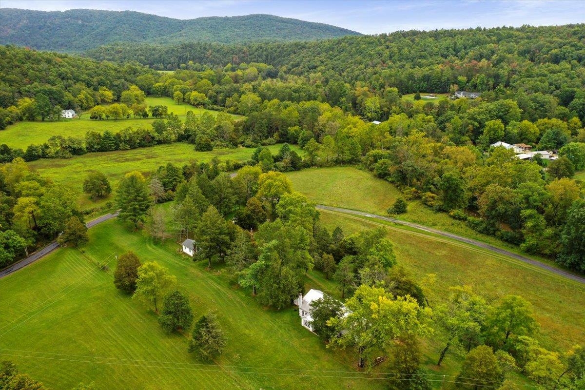 12481 Supinlick Ridge Road Edinburg, VA 22824 - Photo 54 of 75 a view of a lush green hillside and houses