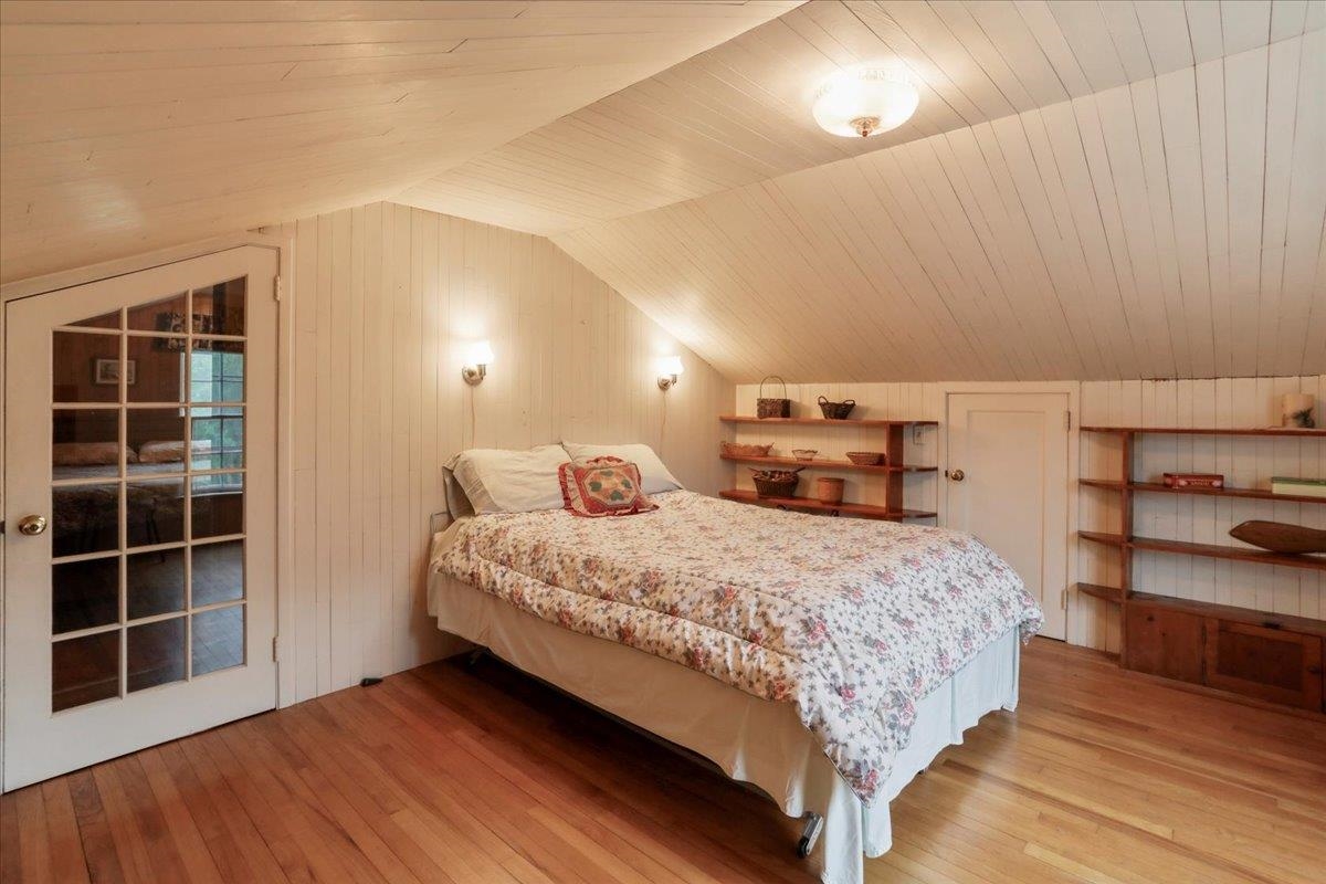 12481 Supinlick Ridge Road Edinburg, VA 22824 - Photo 64 of 75 a bedroom with a bed and a window