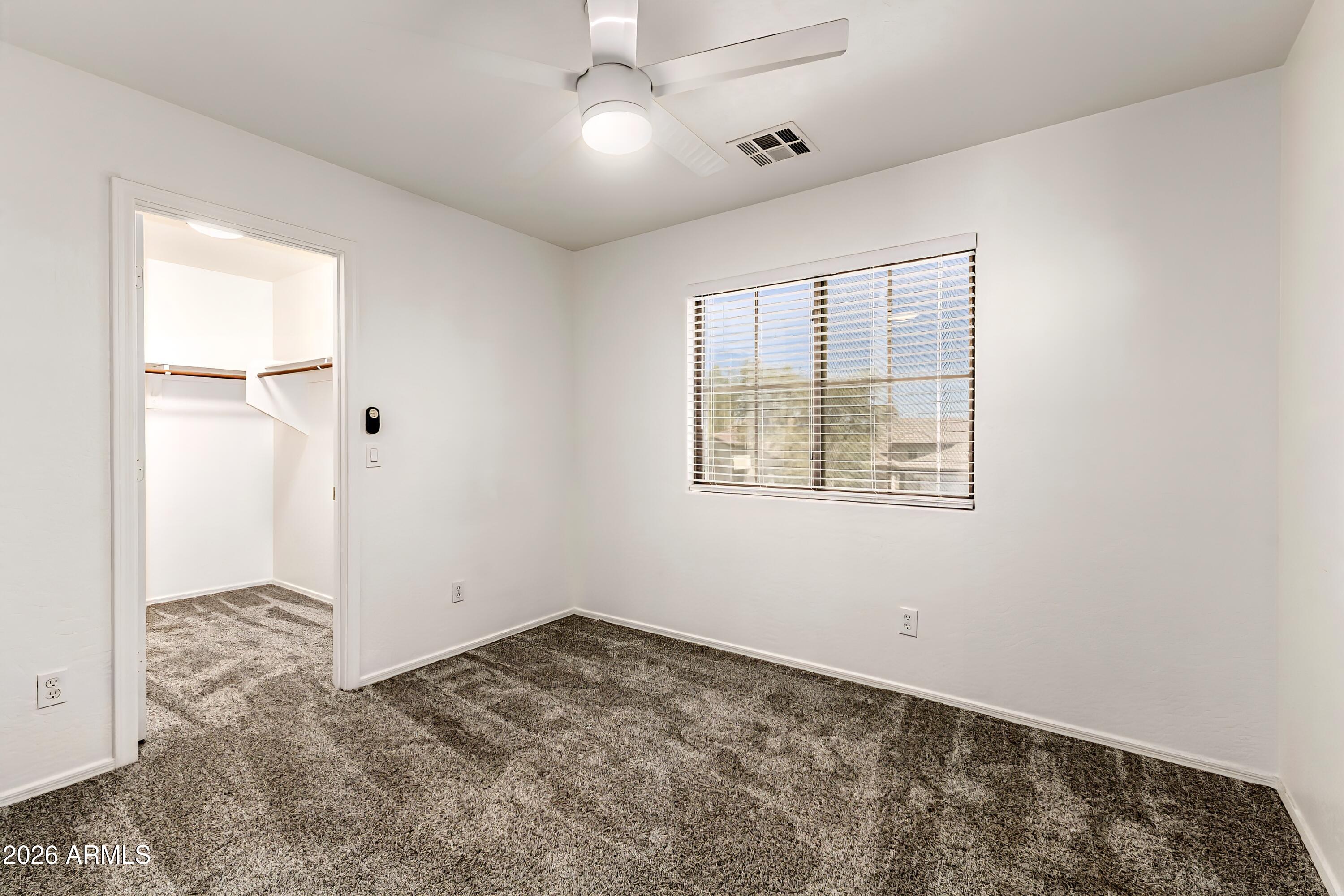 4208 South Sawmill Road Gilbert, AZ 85297 - Photo 30 of 46 wooden floor in an empty room with a window