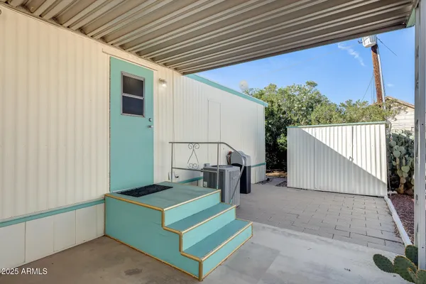 a kitchen with a refrigerator and a sink