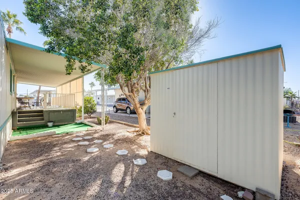 a view of a yard with a tree
