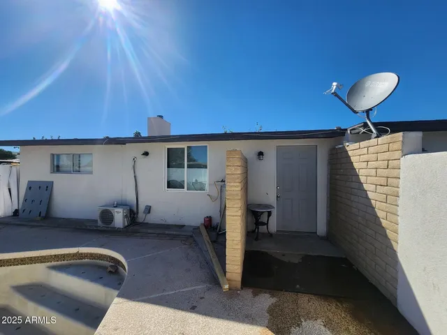 a room with pool table and a large window