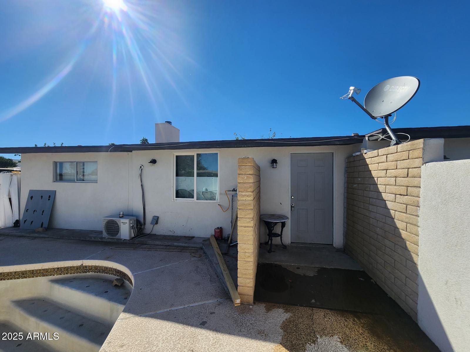 18835 North 25th Way Phoenix, AZ 85050 - Photo 1 of 9 a room with pool table and a large window