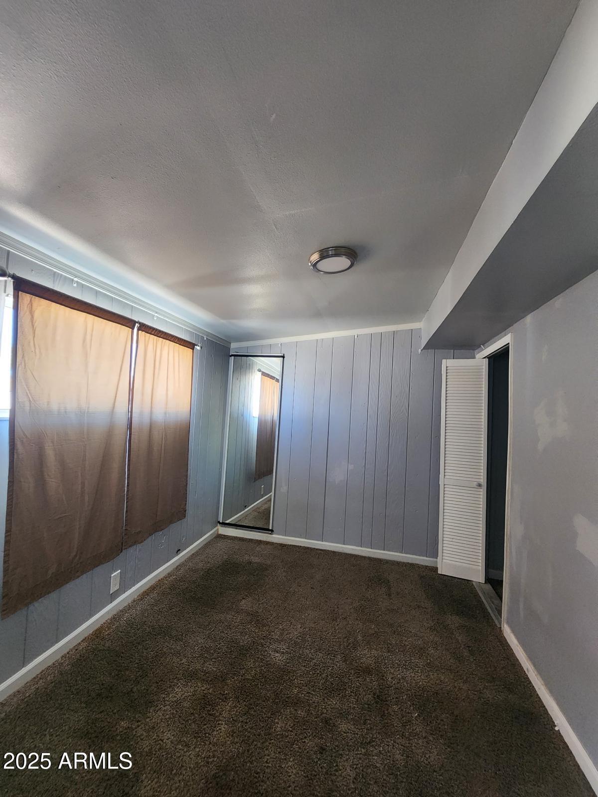 18835 North 25th Way Phoenix, AZ 85050 - Photo 2 of 9 a view of an empty room