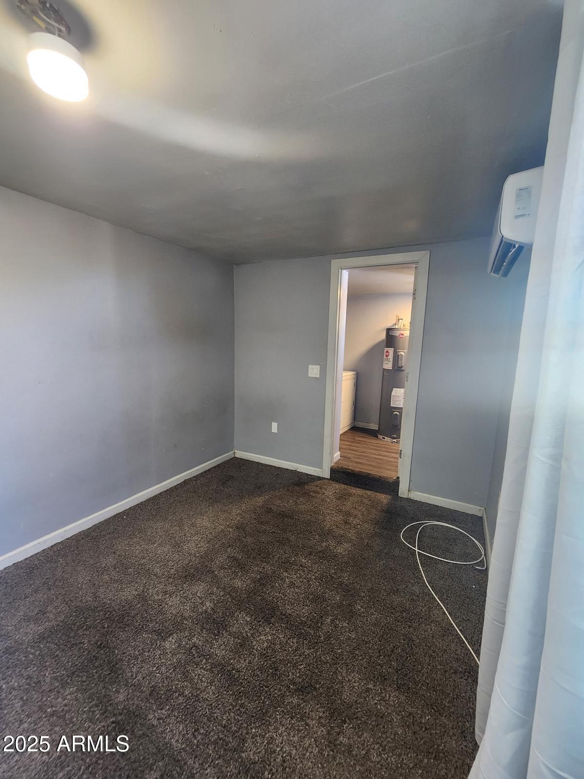 18835 North 25th Way Phoenix, AZ 85050 - Photo 3 of 9 a view of an empty room