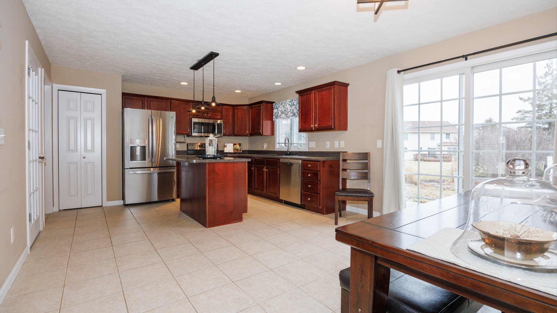 1170 Lynx Lane Normal, IL 61761 - Photo 12 of 46 a kitchen with stainless steel appliances granite countertop a sink refrigerator and cabinets