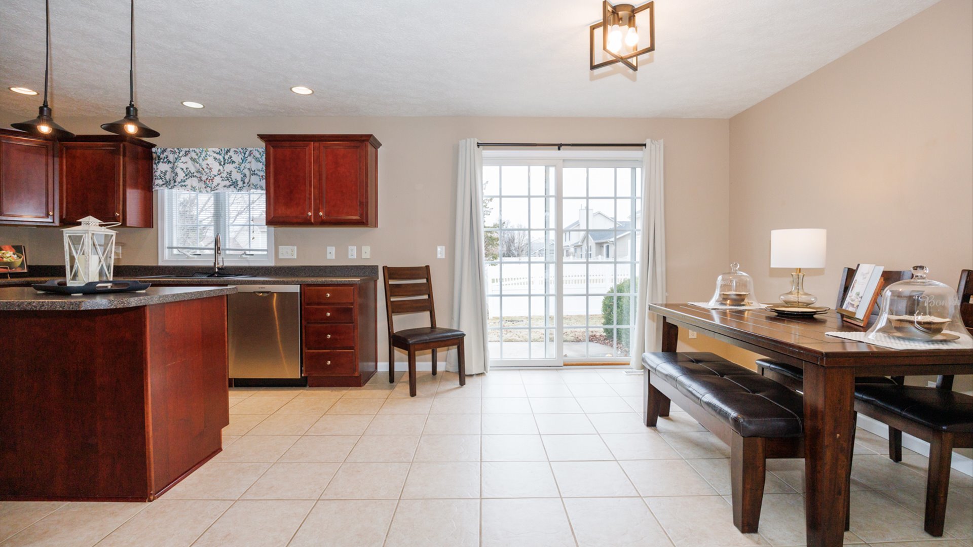 1170 Lynx Lane Normal, IL 61761 - Photo 13 of 46 a kitchen with kitchen island a sink dining table and chairs