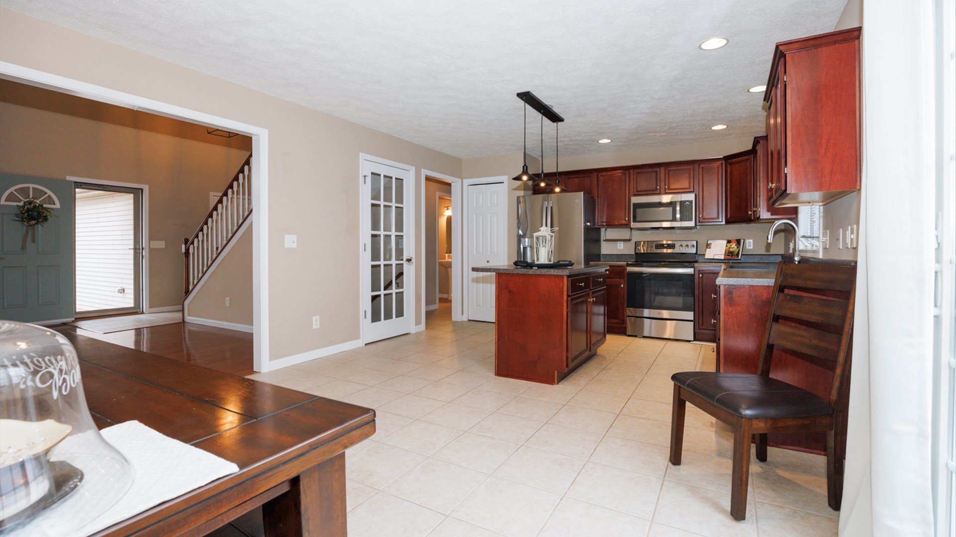 1170 Lynx Lane Normal, IL 61761 - Photo 15 of 46 a kitchen with stainless steel appliances granite countertop a sink a stove and a refrigerator