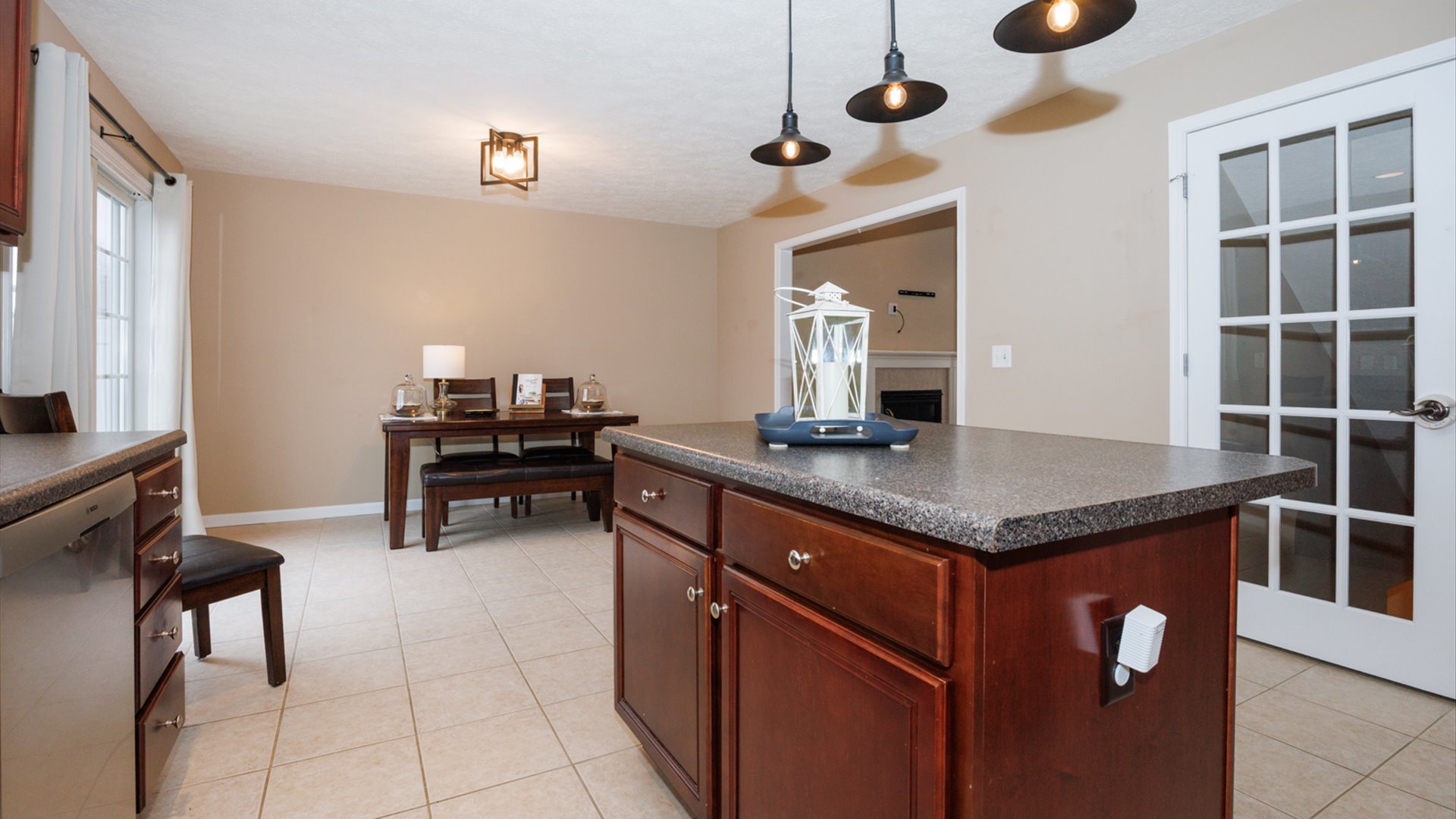 1170 Lynx Lane Normal, IL 61761 - Photo 17 of 46 a kitchen with granite countertop cabinets a stove and a sink