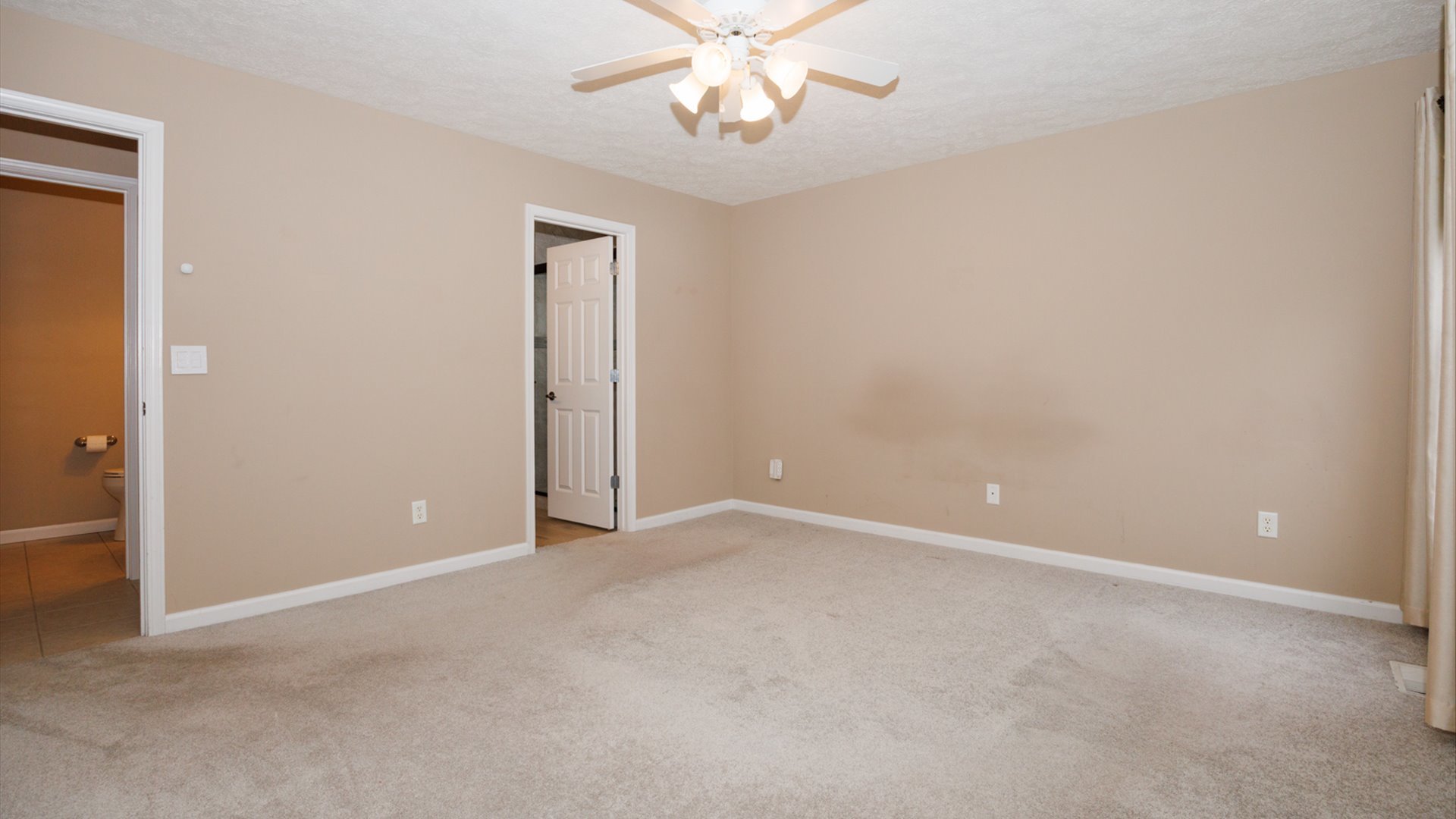 1170 Lynx Lane Normal, IL 61761 - Photo 22 of 46 an empty room with chandelier fan and windows