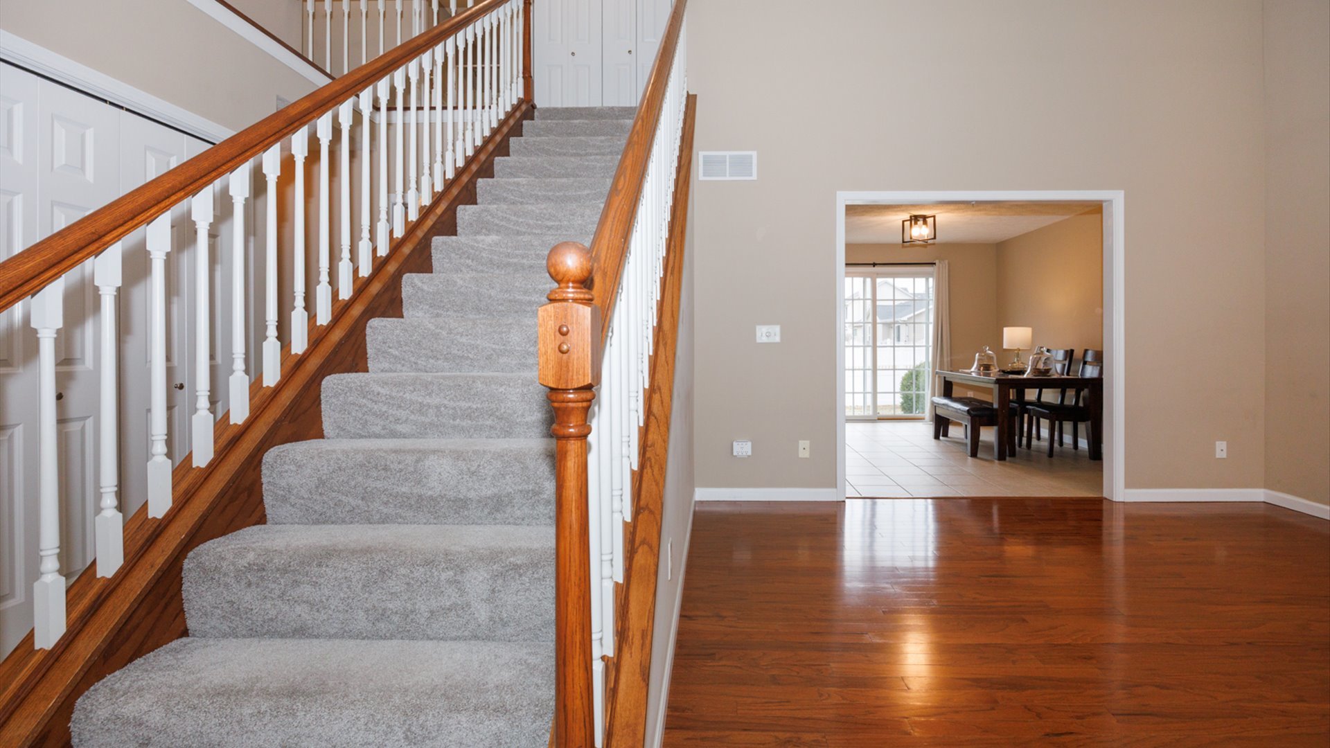 1170 Lynx Lane Normal, IL 61761 - Photo 3 of 46 a view of entryway and hall with wooden floor
