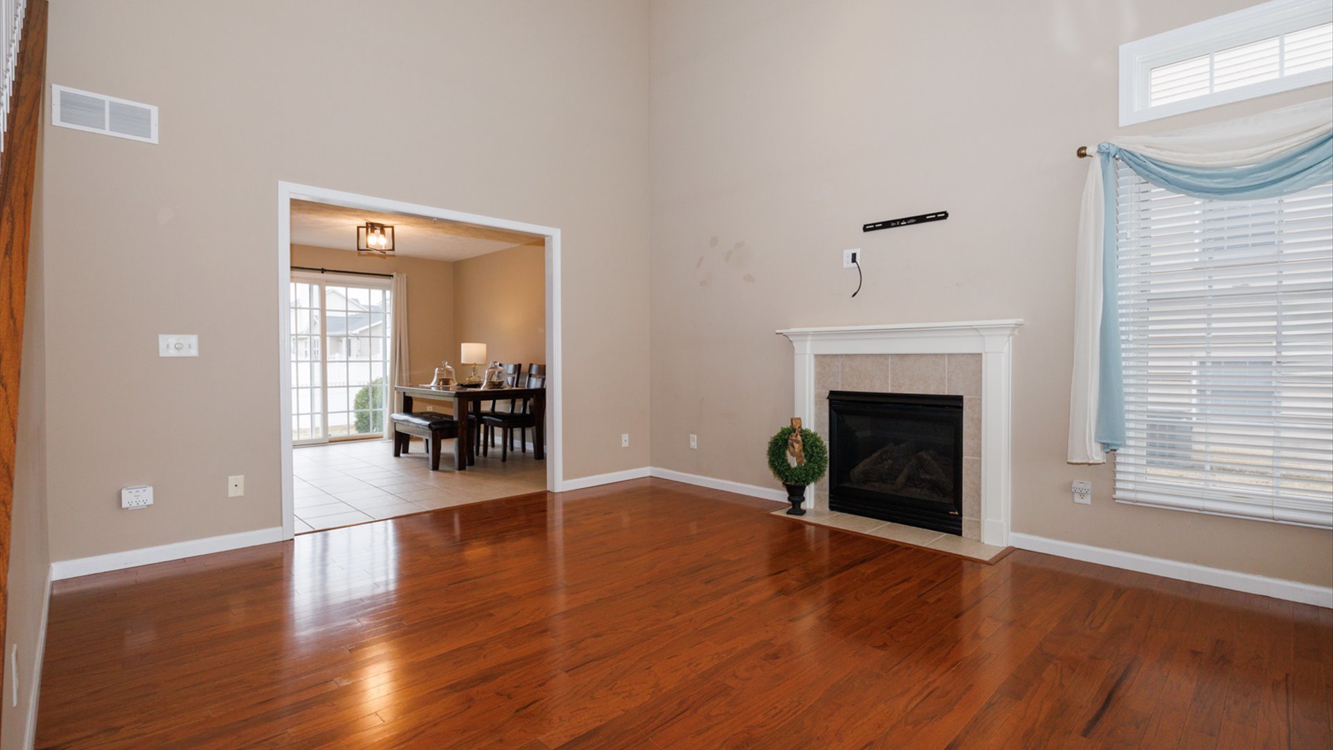 1170 Lynx Lane Normal, IL 61761 - Photo 4 of 46 a view of a livingroom with wooden floor and a fireplace