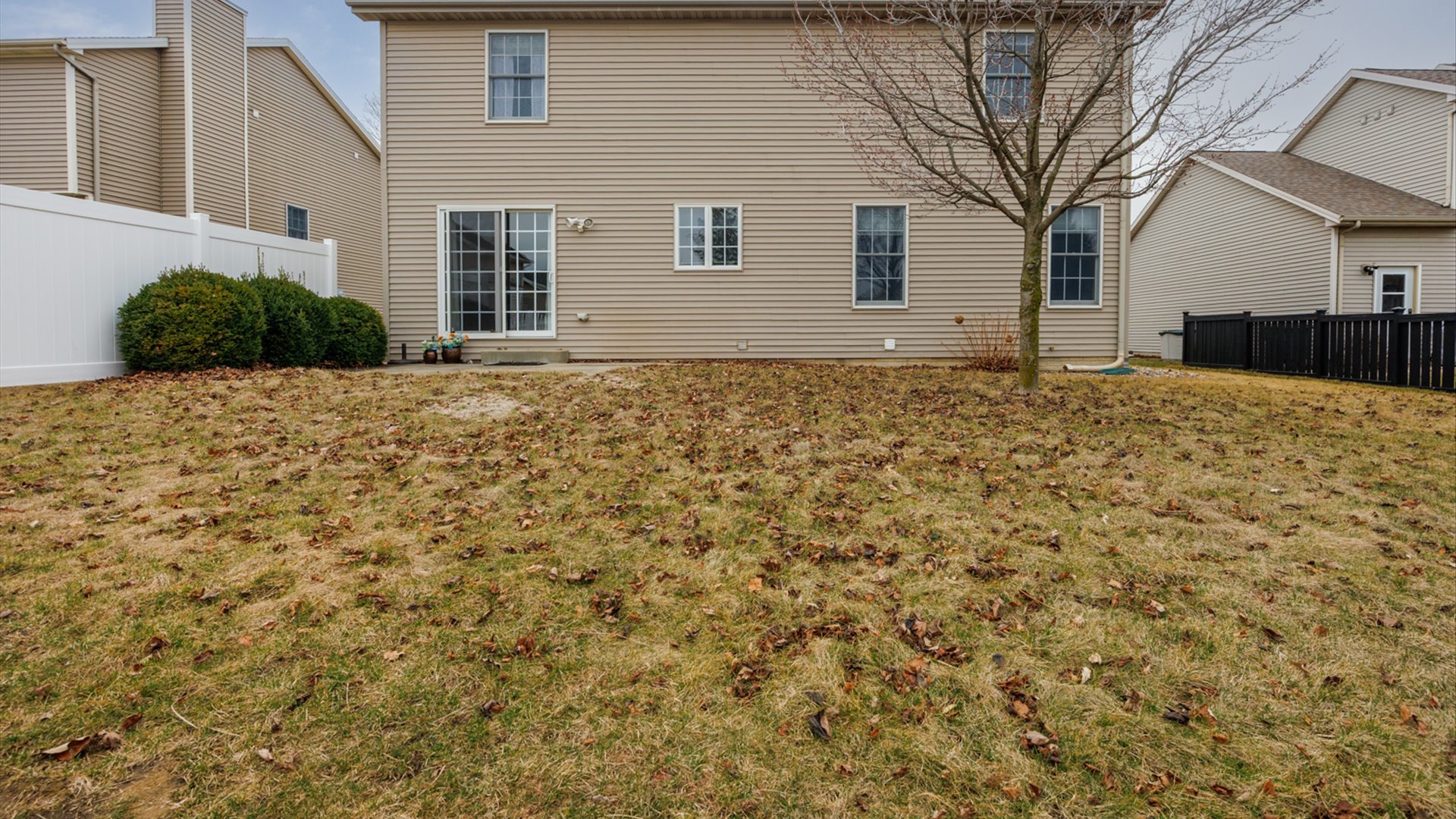 1170 Lynx Lane Normal, IL 61761 - Photo 43 of 46 a large brick house with a large tree