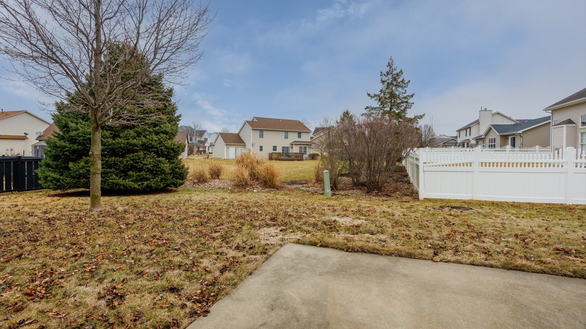 1170 Lynx Lane Normal, IL 61761 - Photo 45 of 46 a view of a house with a yard and large tree