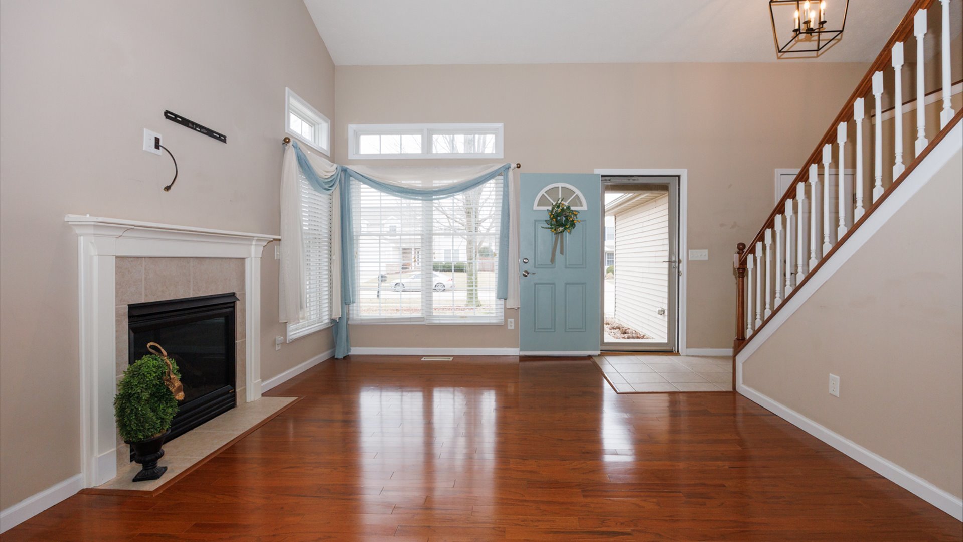 1170 Lynx Lane Normal, IL 61761 - Photo 6 of 46 a view of an empty room with wooden floor fireplace and a window