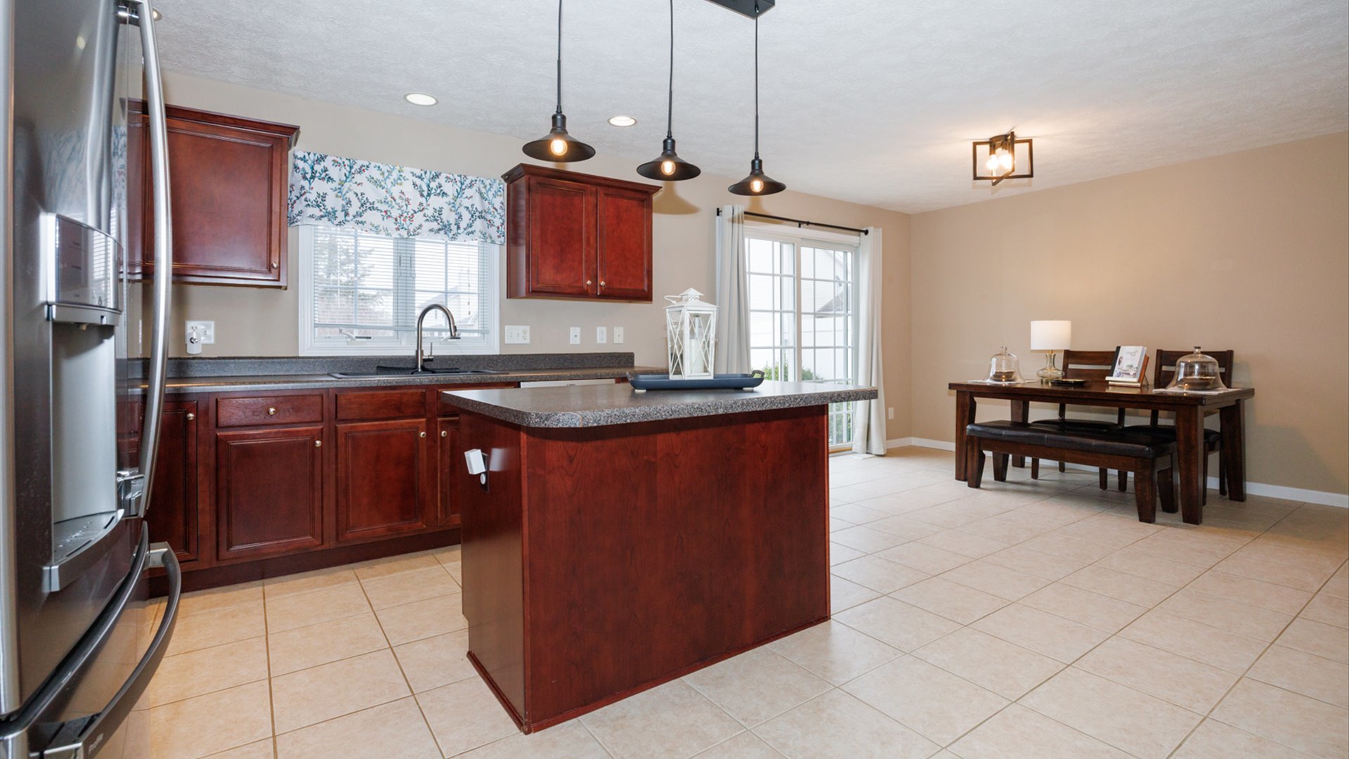 1170 Lynx Lane Normal, IL 61761 - Photo 8 of 46 a kitchen with kitchen island granite countertop a sink a counter and appliances