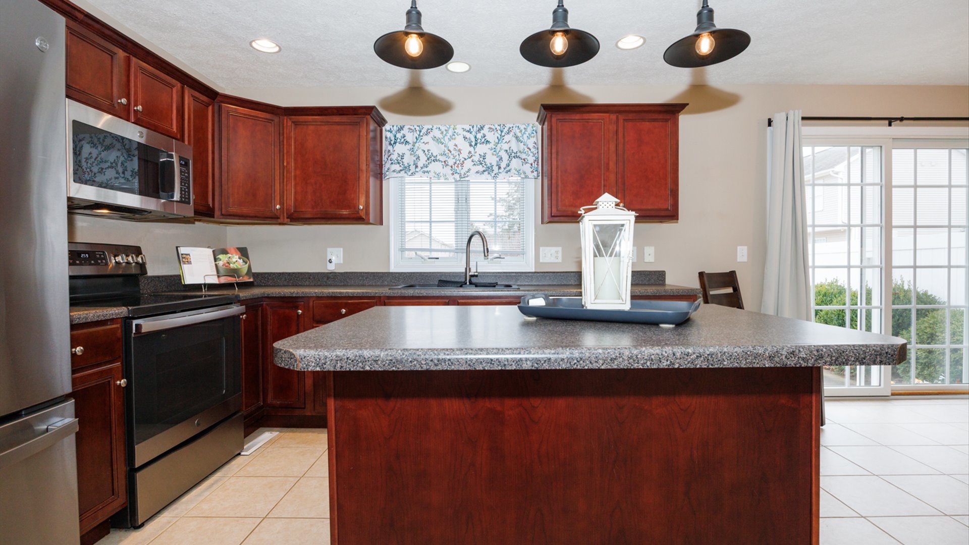 1170 Lynx Lane Normal, IL 61761 - Photo 9 of 46 a kitchen with stainless steel appliances granite countertop a sink window and cabinets