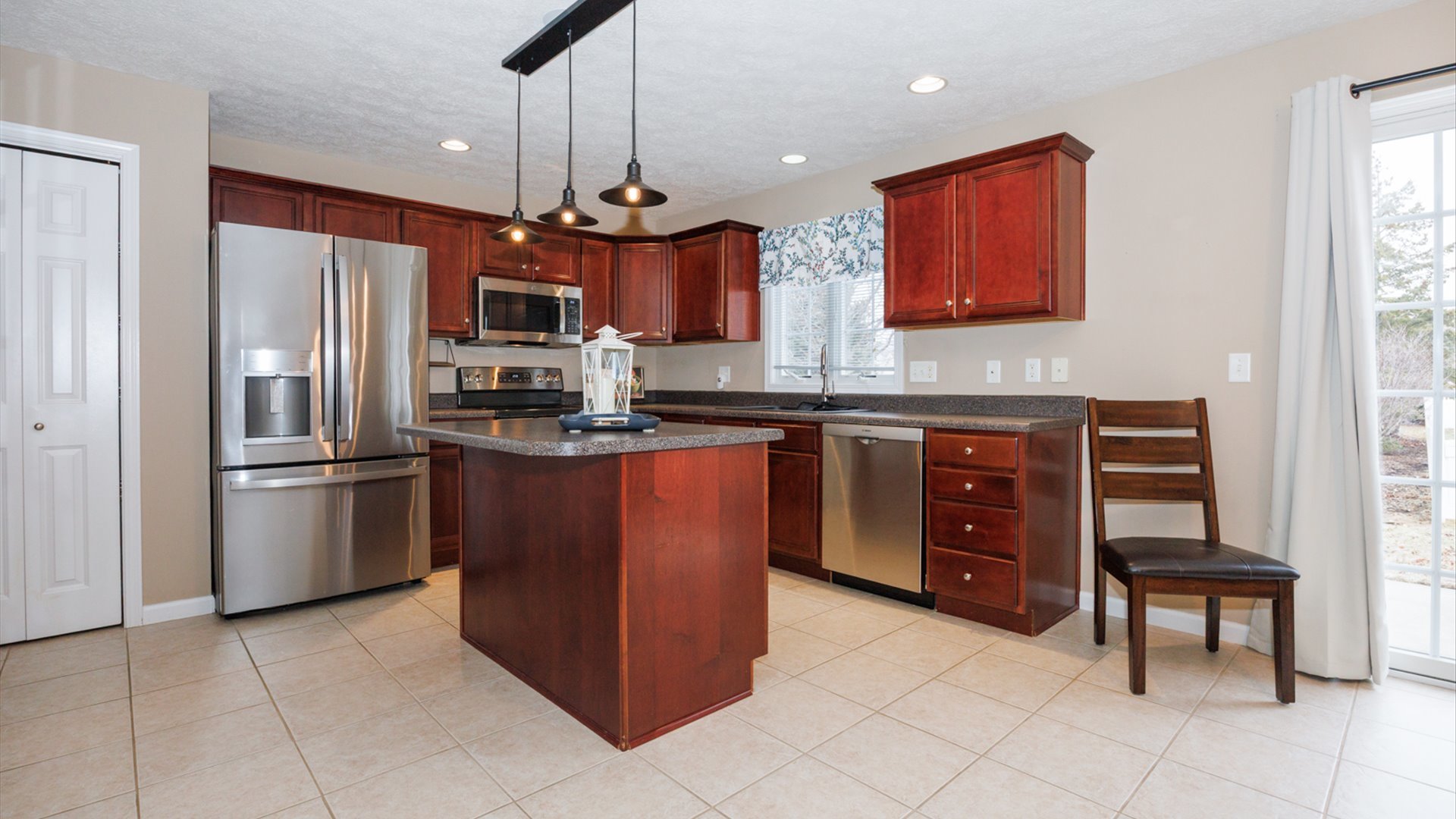 1170 Lynx Lane Normal, IL 61761 - Photo 10 of 46 a kitchen with stainless steel appliances granite countertop a refrigerator and a stove top oven