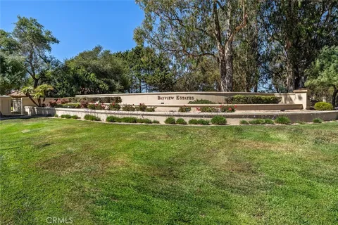 a view of a swimming pool with a yard