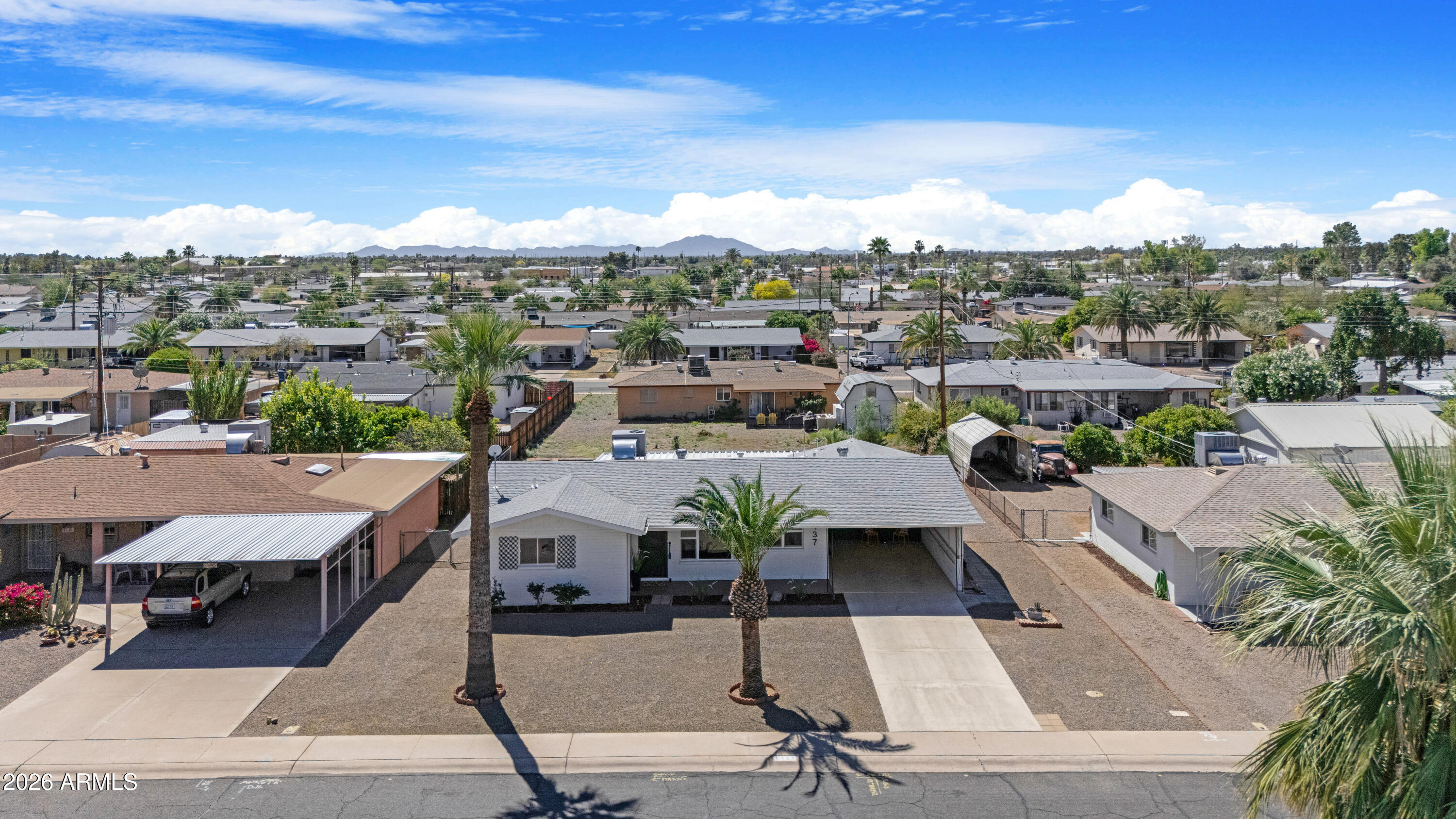 5437 East Butte Street Mesa, AZ 85205 - Photo 40 of 56 an aerial view of a house with yard swimming pool and ocean view