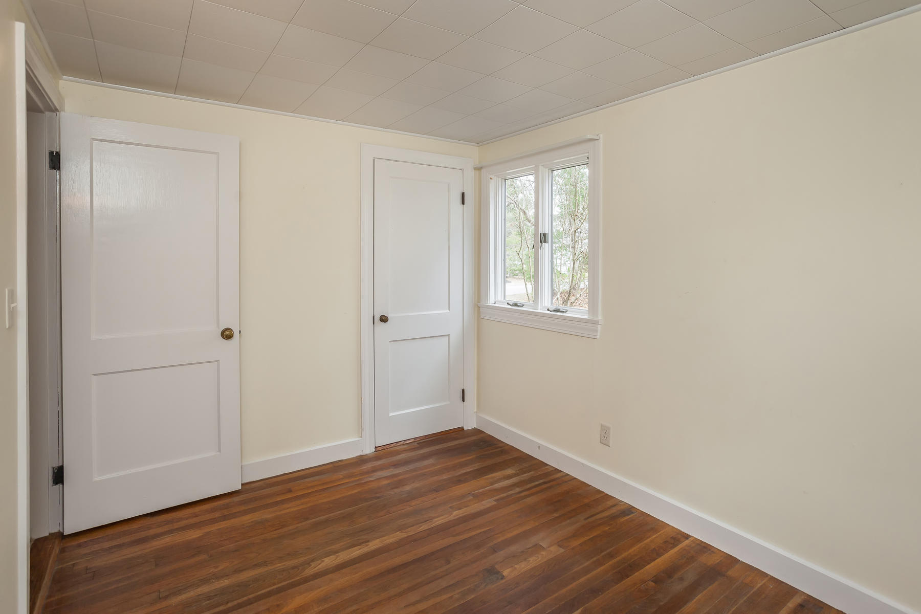 72 Eel Pond Road Bourne, MA 02532 - Photo 13 of 21 a view of an empty room with wooden floor and a window