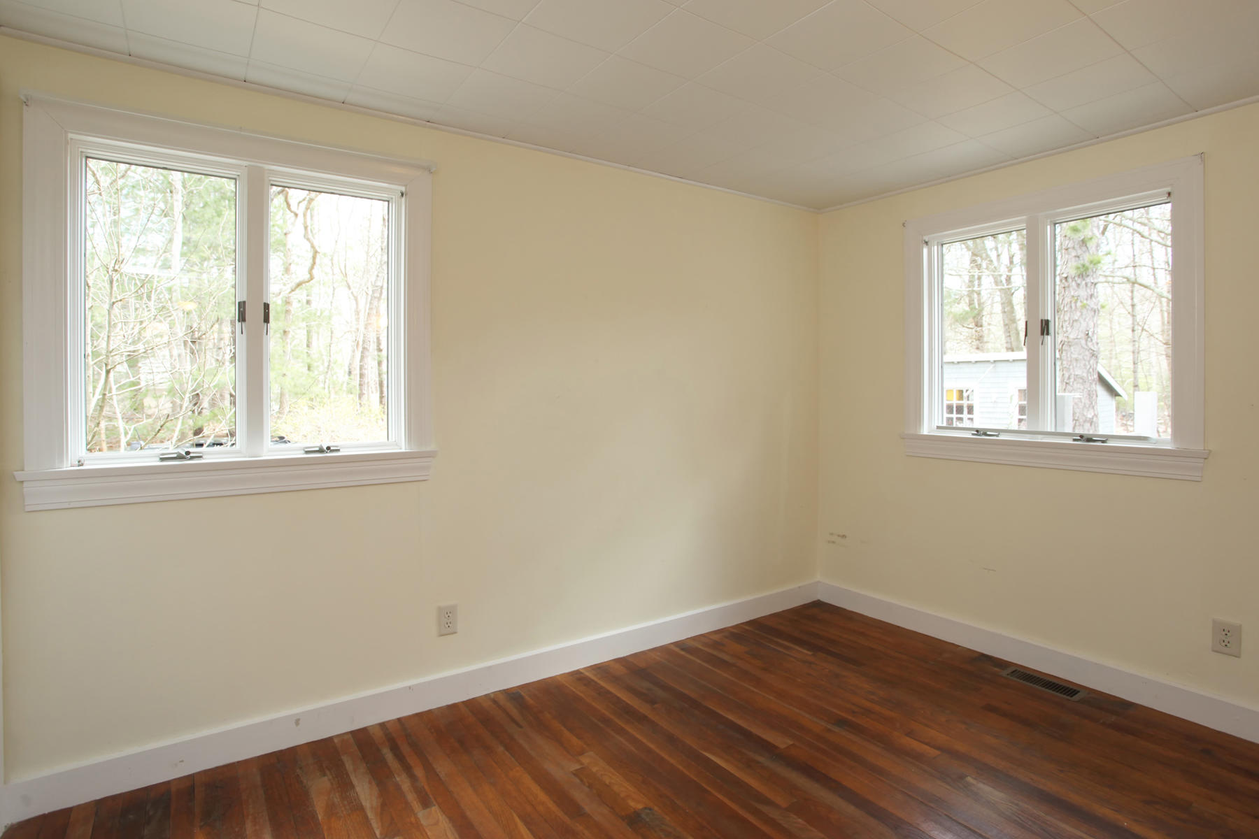 72 Eel Pond Road Bourne, MA 02532 - Photo 14 of 21 a view of a room with wooden floor and windows in it