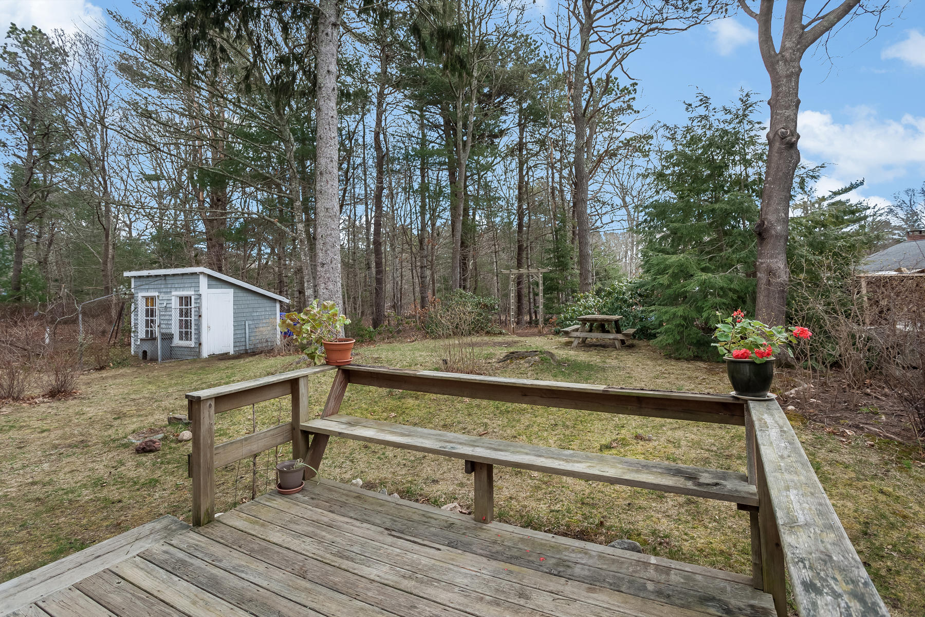 72 Eel Pond Road Bourne, MA 02532 - Photo 18 of 21 a view of a yard with wooden fence