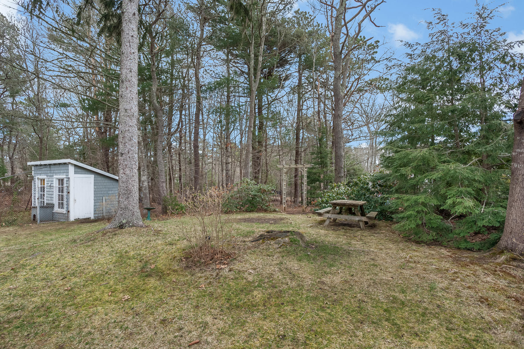 72 Eel Pond Road Bourne, MA 02532 - Photo 19 of 21 a view of a house with a yard and sitting area