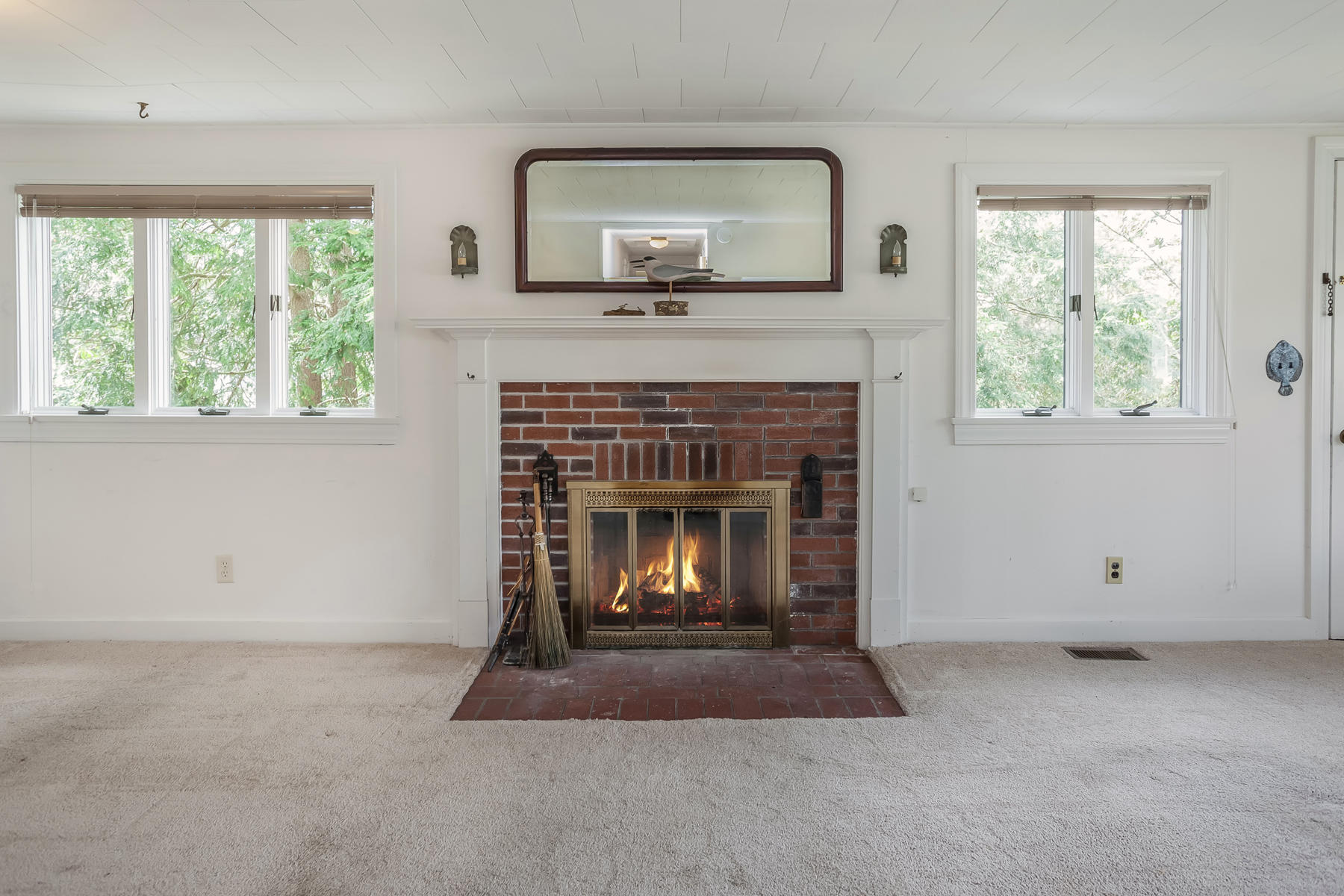 72 Eel Pond Road Bourne, MA 02532 - Photo 5 of 21 a living room with a fireplace and a window