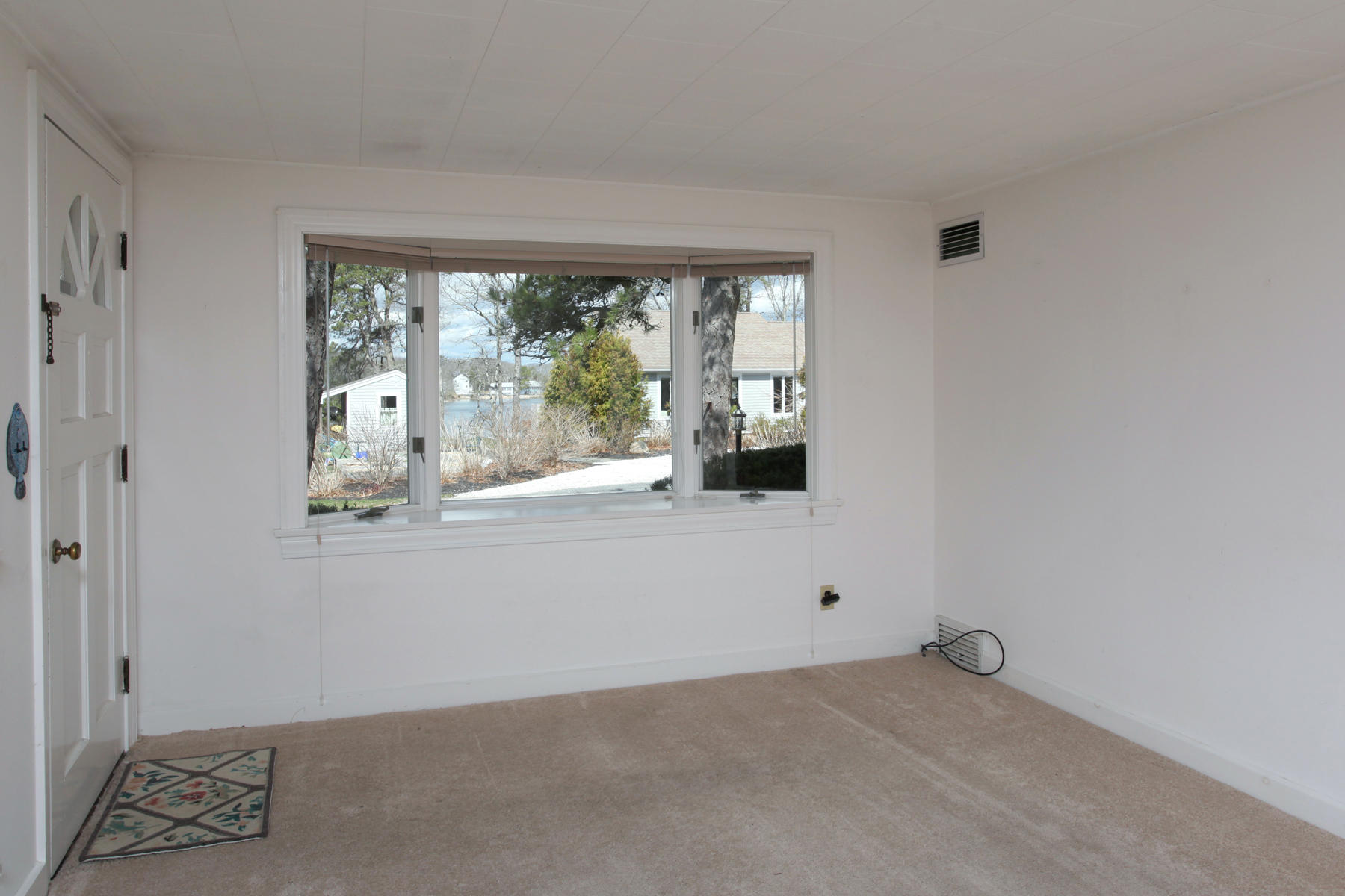 72 Eel Pond Road Bourne, MA 02532 - Photo 6 of 21 a view of an empty room with a window