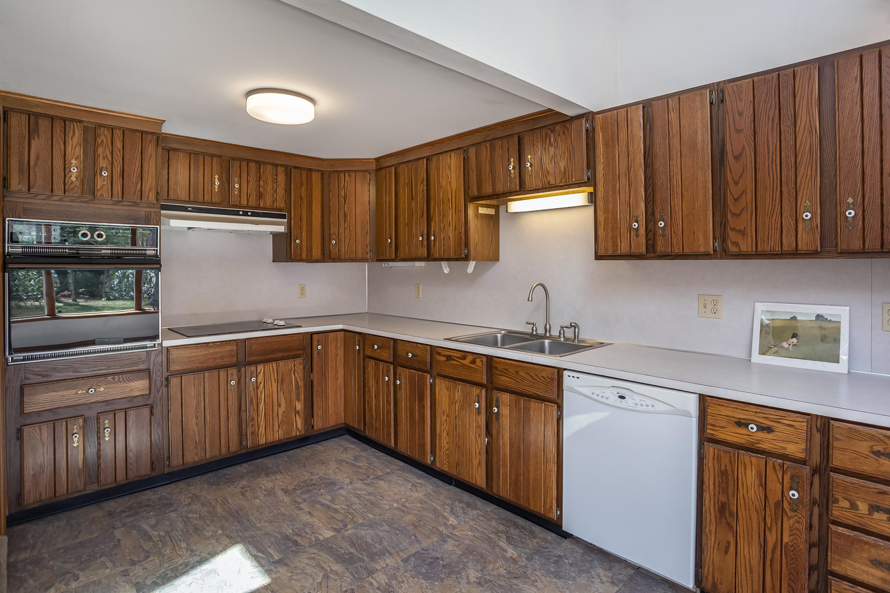 72 Eel Pond Road Bourne, MA 02532 - Photo 8 of 21 a kitchen with stainless steel appliances granite countertop wooden cabinets a sink and dishwasher
